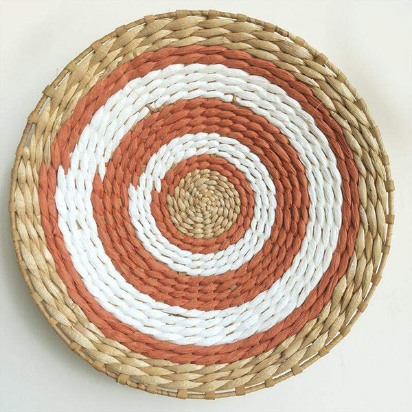Moroccan Rattan Wall Decoration with intricate woven design in natural tones.