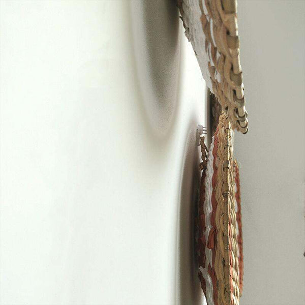 Moroccan rattan wall decoration with intricate rattan grass weaving, adding texture and warmth to interiors.