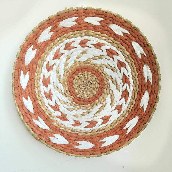 Moroccan rattan wall decoration with intricate woven design, perfect for adding texture to interiors.