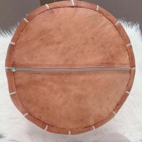 Tan Brown Moroccan Leather Ottoman Pouffe with zippered underside on white background.